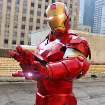 Iron Man's suit lights up at a superhero party.