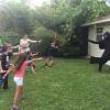 Light Side Warrior teaches young fans how to use the force to push Dark Side Warrior back.