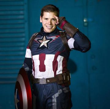 Captain America uses his shield at a superhero party